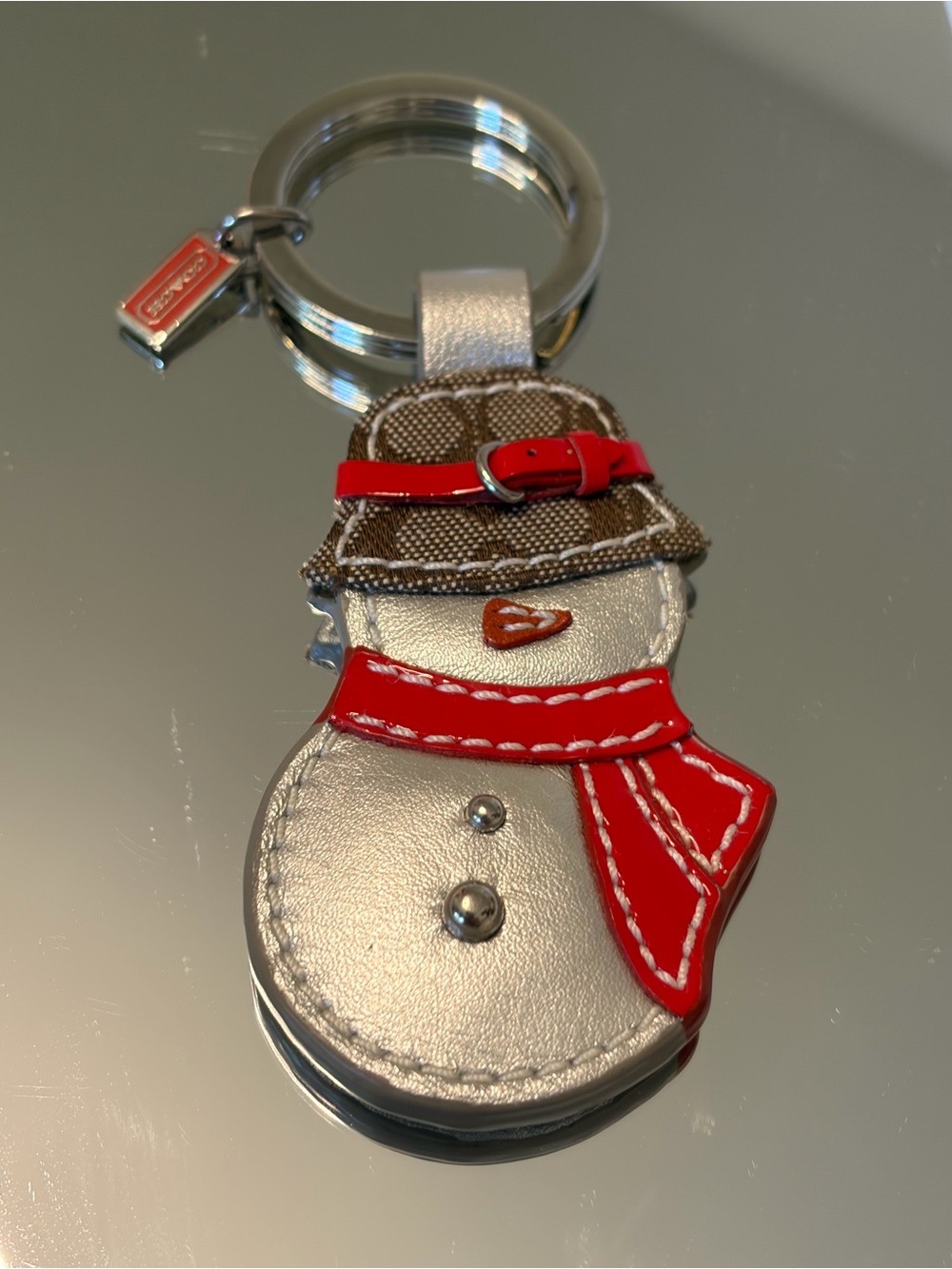 Coach Silver Snowman Keyring with Red Scarf and Brown Hat
